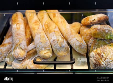 Baguettes On Bread Showcase In A Supermarket Selective Focus Stock