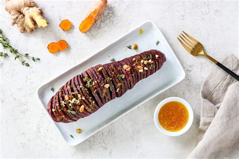 Hasselback Stokes Purple Sweet Potato With Ginger Turmeric Glaze