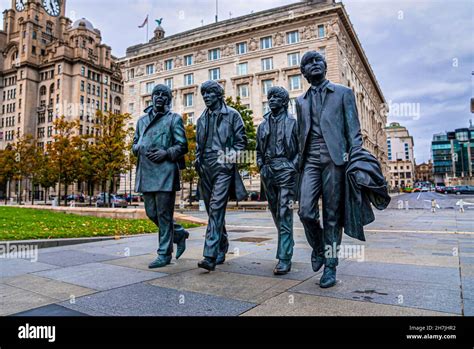 Bronze Statue Of The Beatles At Pier Head In Liverpool Stock Photo Alamy