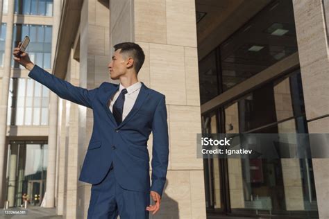 A Young Asian White Collar Worker In A Blue Classic Suit And A White