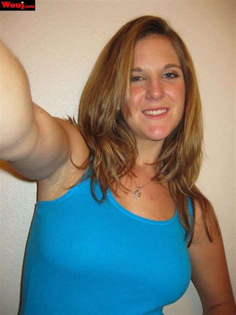 Desirable Brunette Girl Posing In Black Lingerie On The Couch Photos