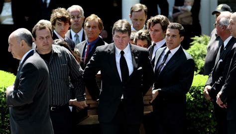 Family and others carry the casket holding Mary Richardson Kennedy ...