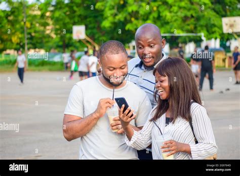 Happy Group Of African Friends Consisting Of Two Guys And A Lady