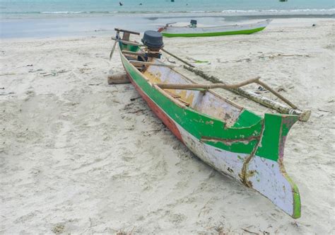 Premium Photo Boats Moored On Sandy Beach