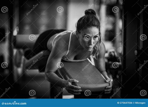 Woman Exercising At Lying Leg Curl Bench Stock Photo Image Of