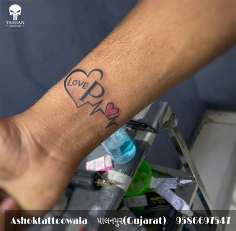 Love p heart tattoo || | Hand tattoos for guys, Wrist tattoos for guys, Around arm tattoo