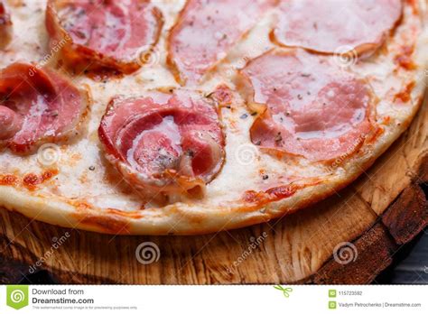 Close Up Of Tasty Pizza With Bacon Salamiham And Pepperoni It Stock