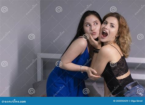 Two Pretty Teenage Girls Blonde And Brunette Having Fun In Grey Bedroom Friendship