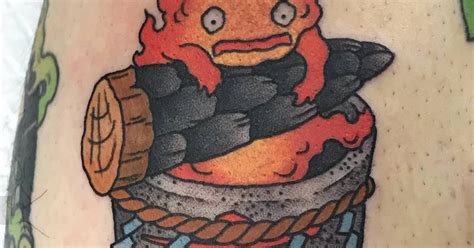 Calcifer Tattoo Located On The Calf Cartoon Style