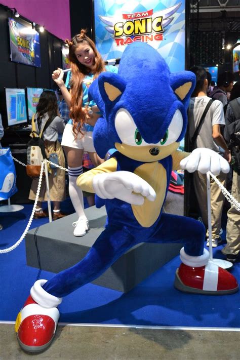 Sonic The Hedge Mascot Is Posed In Front Of People