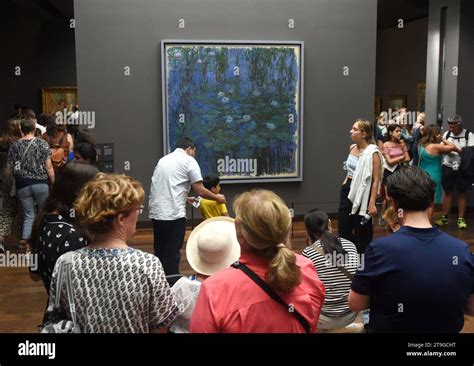 Paris, France - August 29, 2019: Crowd of visitors near the Blue Water ...