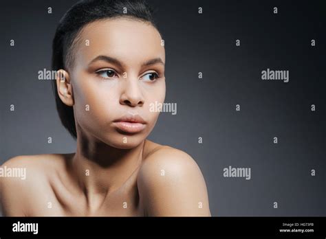 Beautiful Attractive Woman Standing Against The Black Background Stock