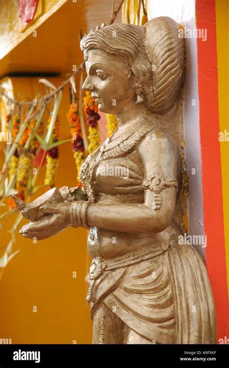 Statue on the entrance gate to the Hindu temple in Munnar, a hill ...