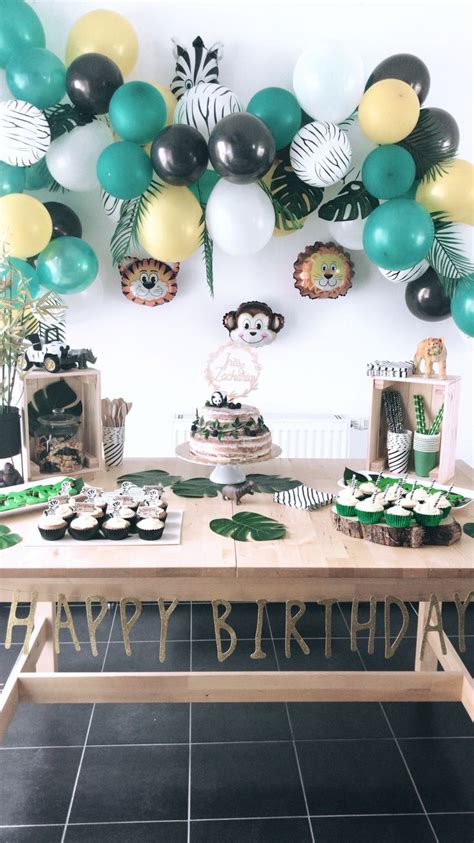 A Birthday Party With Balloons And Decorations