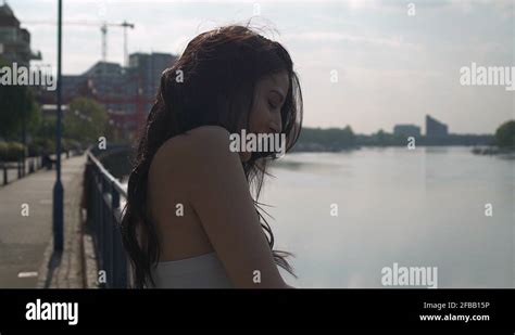 Beautiful Latina Woman On Holiday Leaning Against The Railing Looking At Stock Video Footage