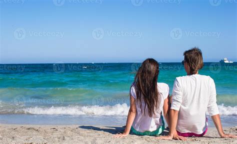 Happy family at white beach during tropical vacation 18831391 Stock Photo at Vecteezy