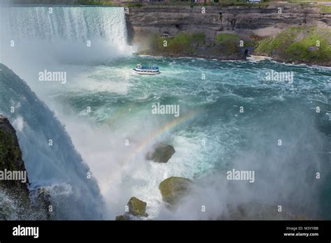 Niagara Falls, Tour Boat under Horseshoe Waterfall with Rainbow Stock ...