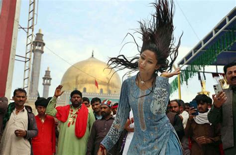 Devotees performing dhamal at the shrine of Hazrat Lal Shahbaz Qalandar ...