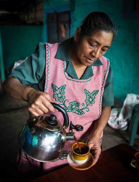 Amelia The Wife Of One Of Our Coffee Farmers Pouring Freshly Roasted