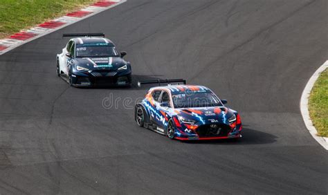 Electric Cars Battle In Action Racing On Asphalt Track Cupra And