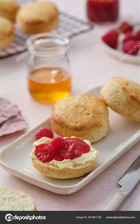 Traditional British Scones with clotted cream, raspberry jam. Scones ...