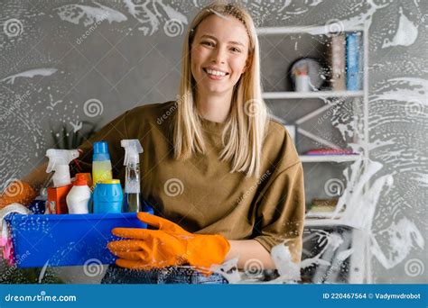 Blonde Woman Maid Holding Basket Full Of Cleaning Products Stock Photo Image Of Spray Basket
