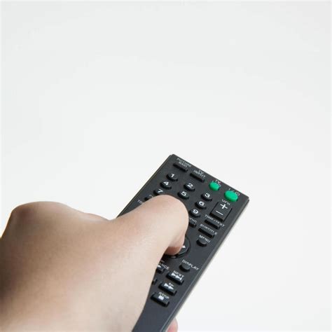 Premium Photo Hand Holding Television Remote Control Isolated On