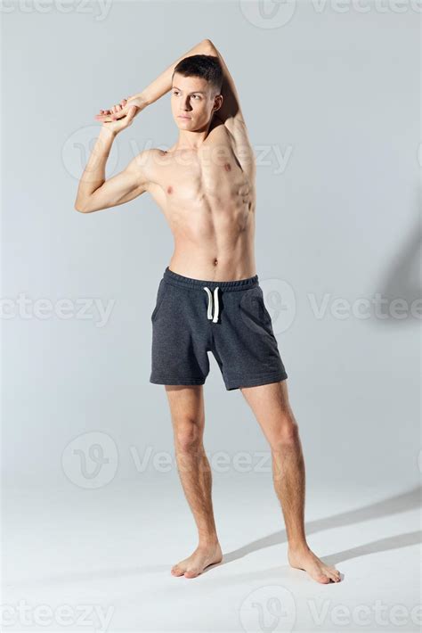 Athlete In Shorts With A Naked Torso Joined Hands Behind The Head 22458217 Stock Photo At Vecteezy