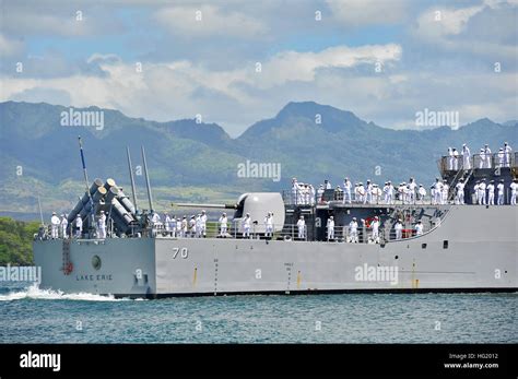 Sailors man the rails as the guided-missile cruiser USS Lake Erie (CG 70) returns to Joint Base ...