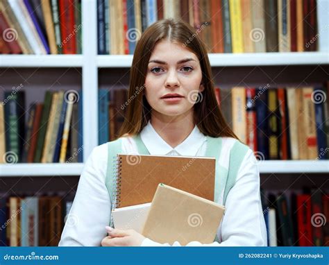 Portrait Of Student Against Bookcase In Library Stock Image Image Of