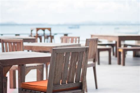 Premium Photo Chair And Table Of Cafe Restaurant On Balcony Deck At