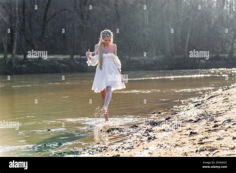 A Lovely Blonde Model Enjoys An Spring Day Outdoors Stock Photo Alamy