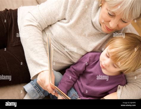 Boy Reading Book Granny Hi Res Stock Photography And Images Alamy