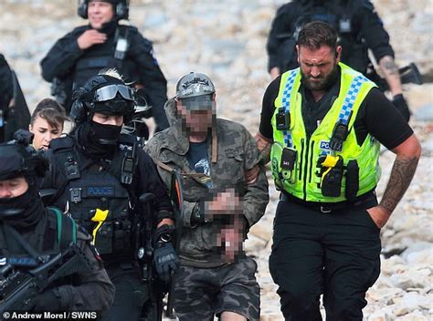 Armed Police Swoop On Beach And Suspected Gunman Wearing Camouflage Is