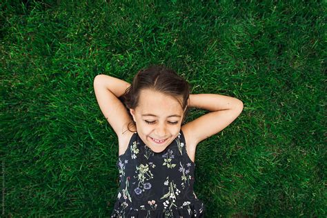 "Child Laying In Grass" by Stocksy Contributor "Alison Winterroth ...