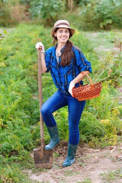 Premium Photo Happy Smiling Caucasian Female Farmer Or Gardener Holding Spade And Basket Of