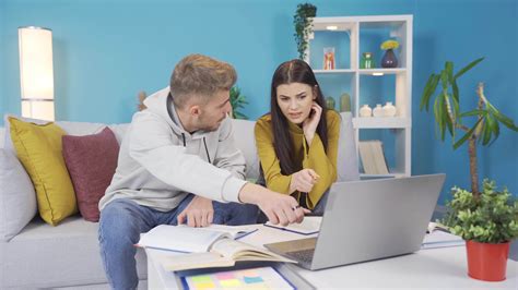 Student girl and boy study at home. Two friends study at home. University students study