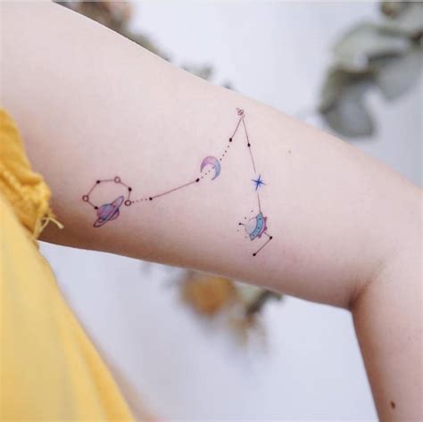 Watercolor Pisces Constellation Tattoo On The Bicep