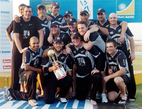 New Zealand players pose with the trophy | ESPNcricinfo.com