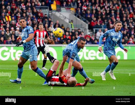 Brentford S Ben Mee Goes Down Whilst Battling For The Ball With Aston