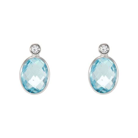 Boucles D Oreilles Or Blanc Topaze Bleue Trait E Ovale X Mm Et