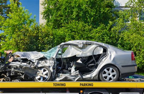 Crashed Luxury Car Parked on a Tow Truck. Stock Image - Image of crash, damage: 38098647