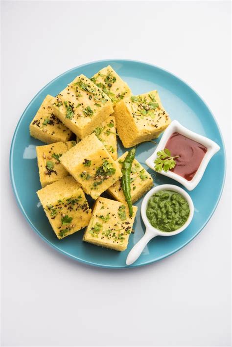 Gujarati Khaman Dhokla Or Steamed Gram Flour Puffy Snack Cake Stock