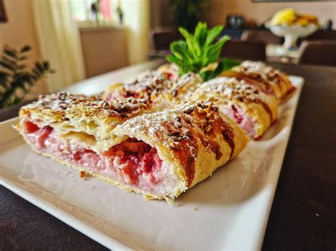 Strudel Like Filled With Milk And Strawberries Cream Topped With Honey And Crushed Pistachio