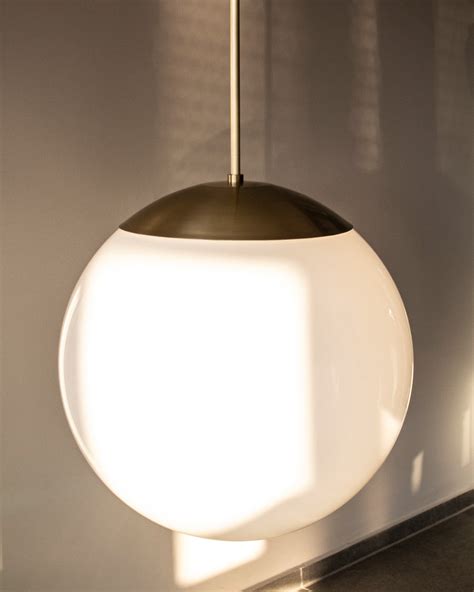 Schwung Dries Brass And Glass Pendant Light Luminesy