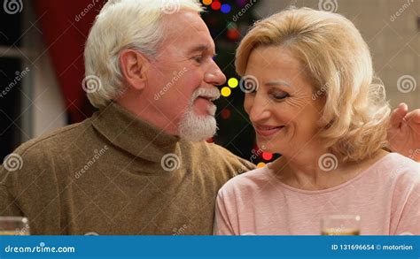 Old Man Tenderly Kissing Wife Celebrating Xmas Happy Together Till