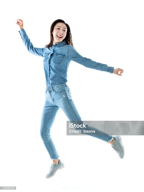 Excited Woman Jumping On White Background Stock Photo Download Image