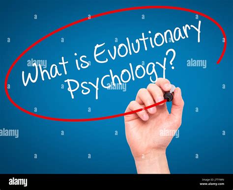 Man Hand writing What is Evolutionary Psychology? with black marker on visual screen. Isolated ...