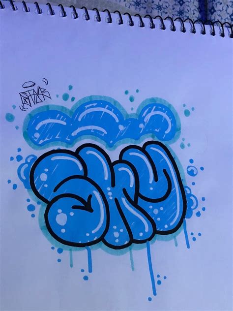 Graffiti Written In Blue Ink On White Paper