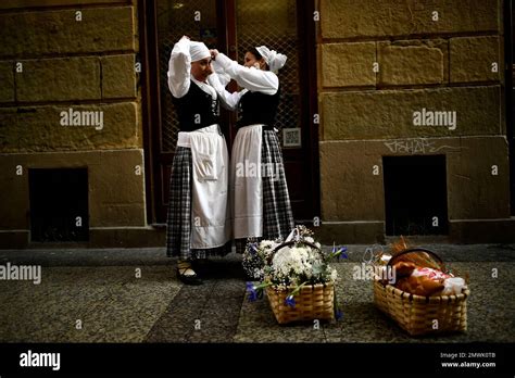 Two Female Tamborilleros Wearing Their Uniforms Prepare To Take Part